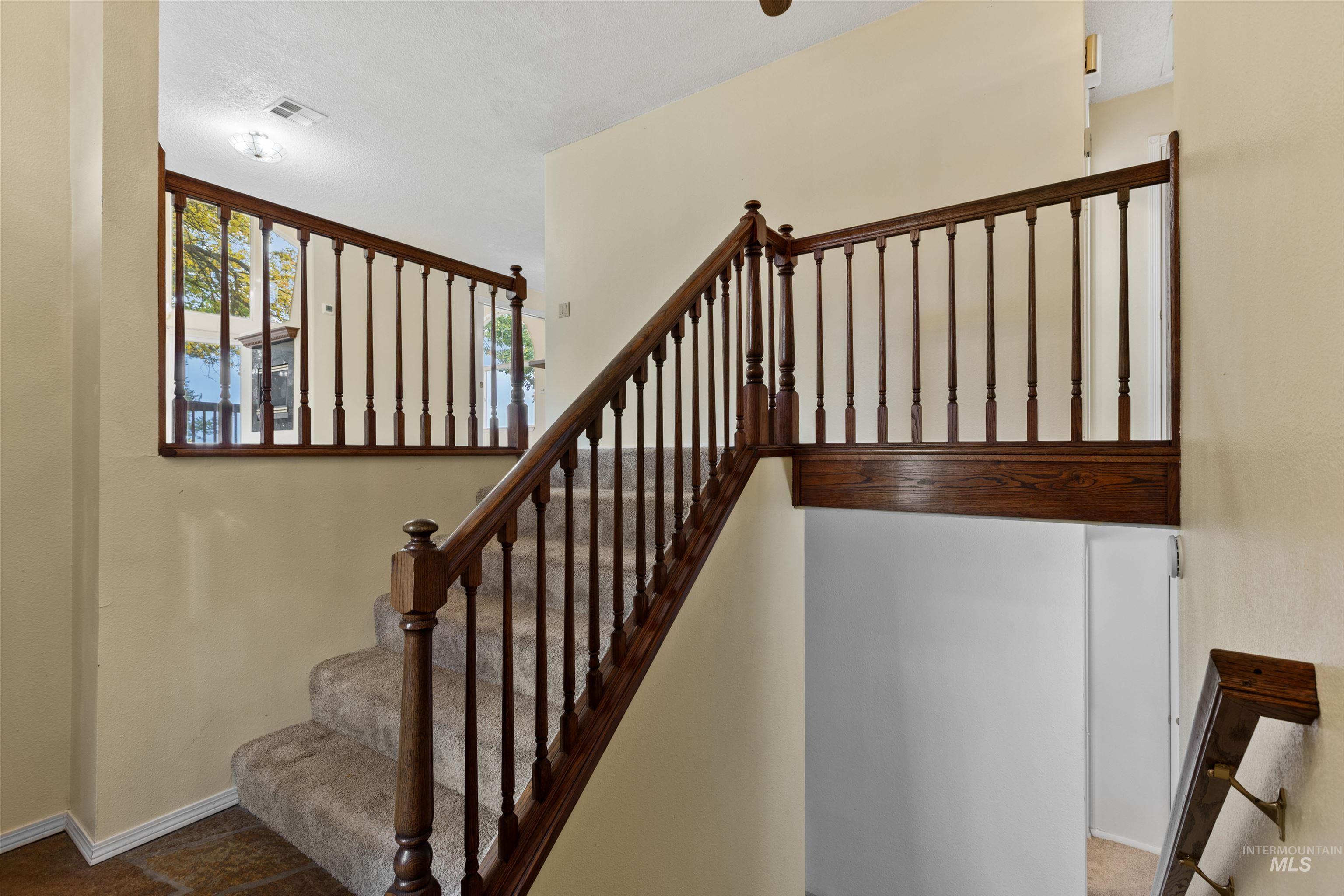 9948 Ash Lane Payette, ID 83661 - Photo 18 of 34 Stairway with baseboards