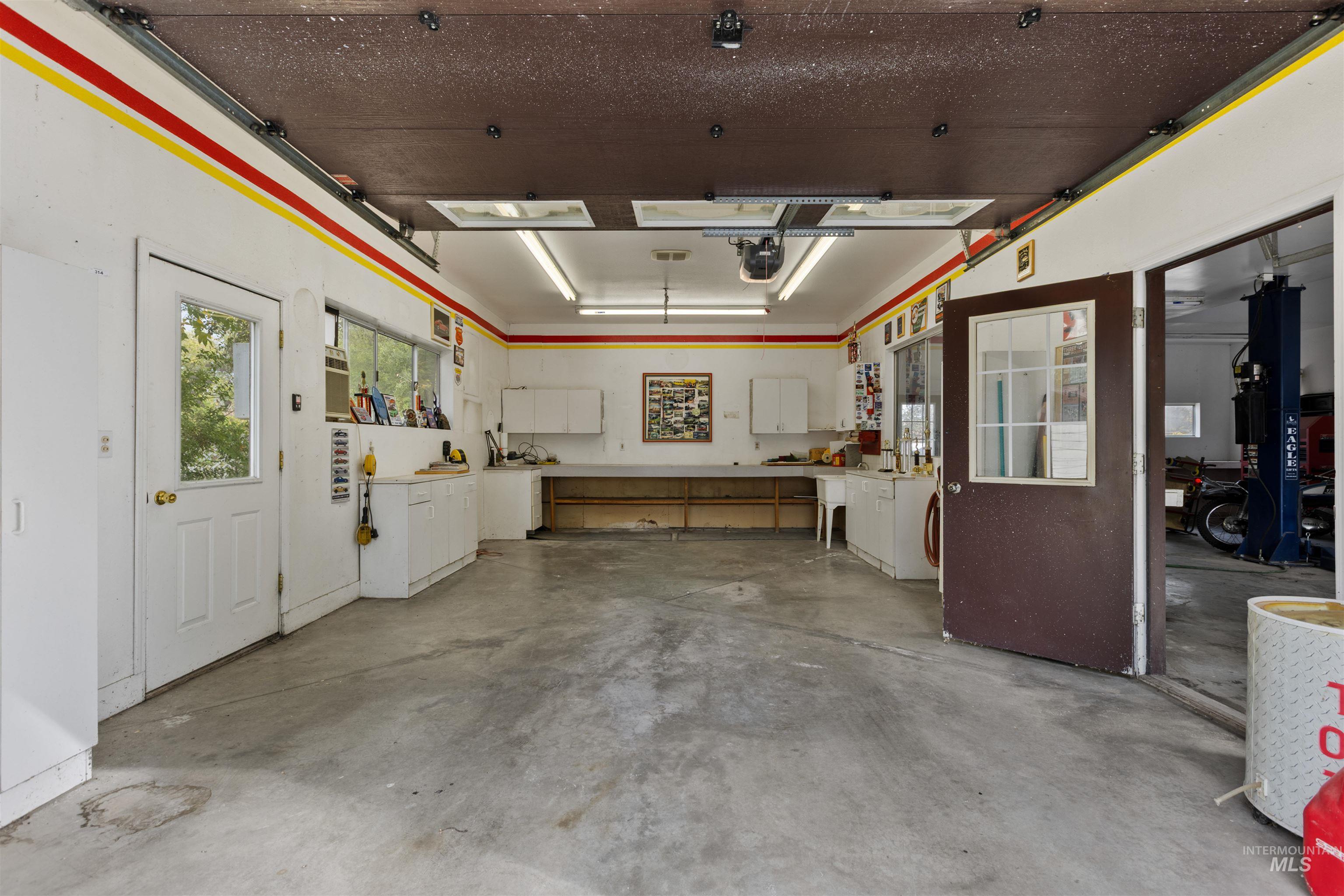 9948 Ash Lane Payette, ID 83661 - Photo 28 of 34 Garage featuring a garage door opener