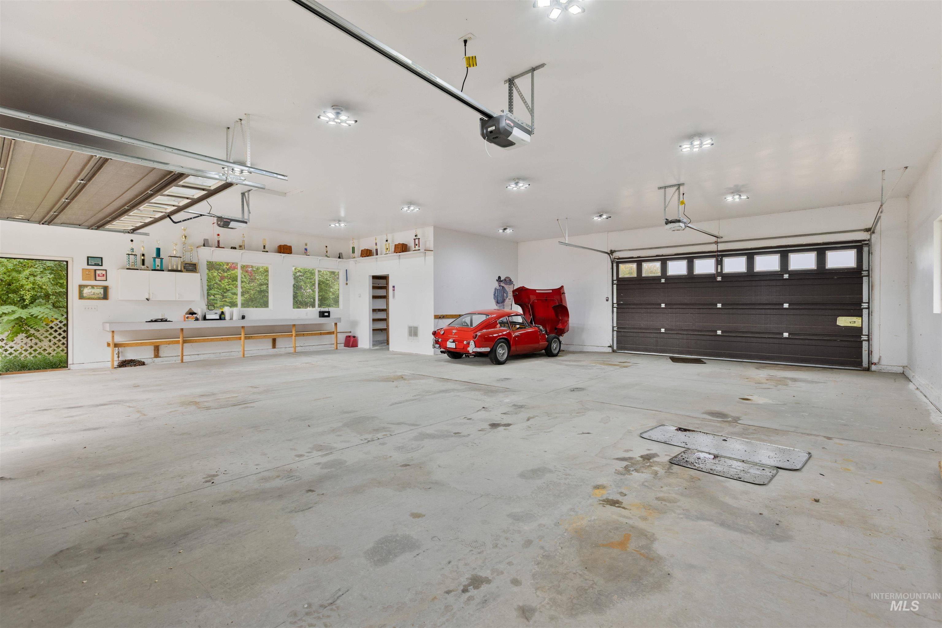 9948 Ash Lane Payette, ID 83661 - Photo 31 of 34 Garage featuring a garage door opener