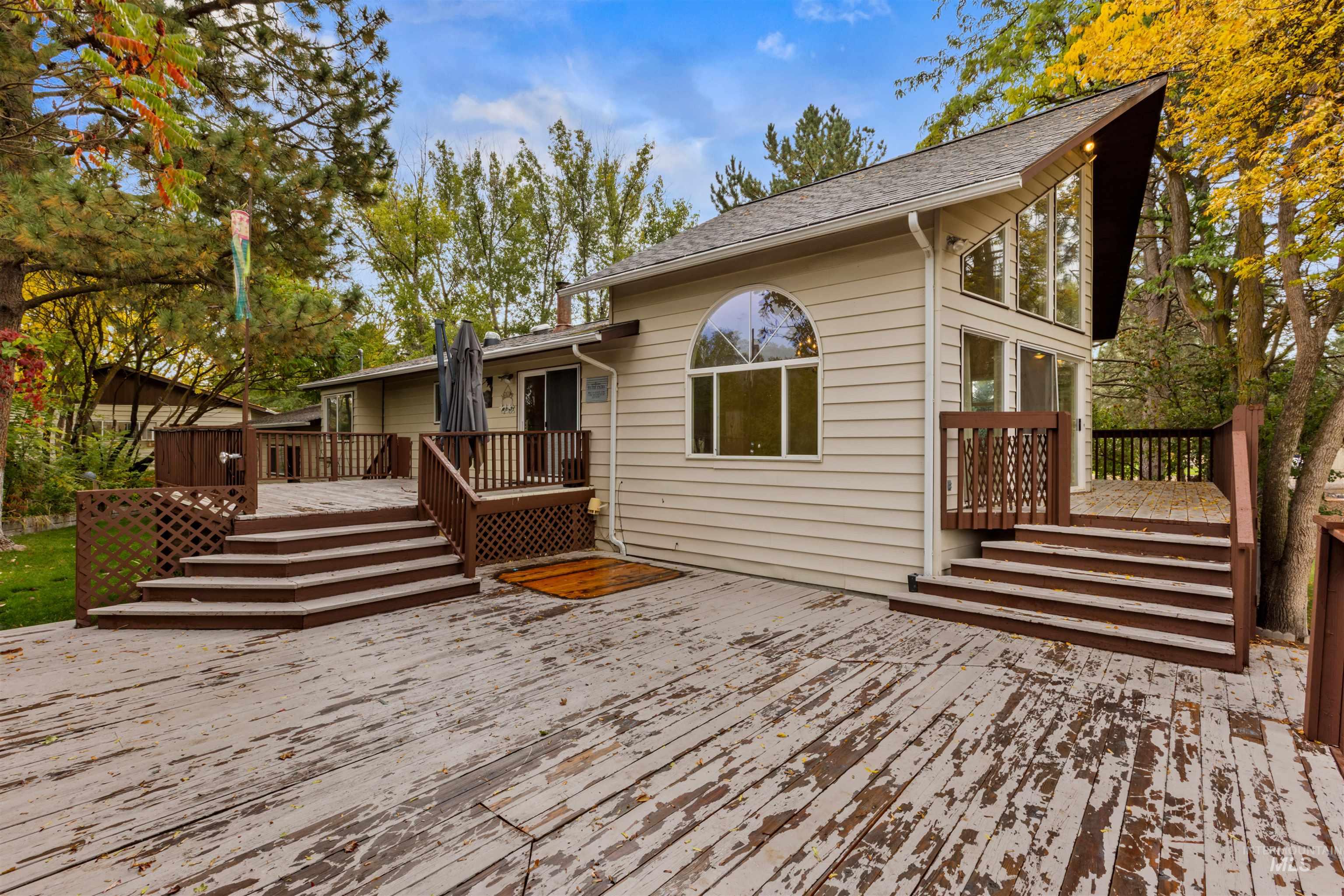 9948 Ash Lane Payette, ID 83661 - Photo 34 of 34 Rear view of house featuring a wooden deck and roof with shingles