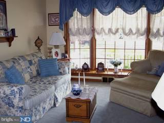 995 Birch Road Warminster, PA 18974 - Photo 2 of 6 a living room with furniture and a floor to ceiling window