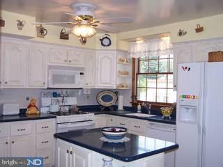 995 Birch Road Warminster, PA 18974 - Photo 3 of 6 a kitchen with a refrigerator a stove a sink and a cabinets