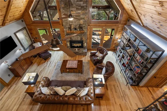 a view of a balcony with chairs and wooden floor