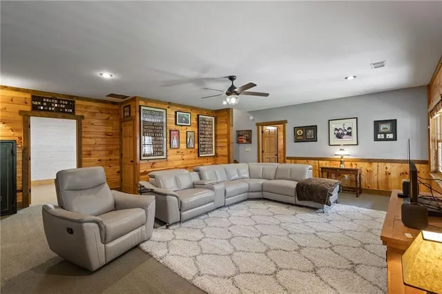 a living room with lots of furniture and a flat screen tv