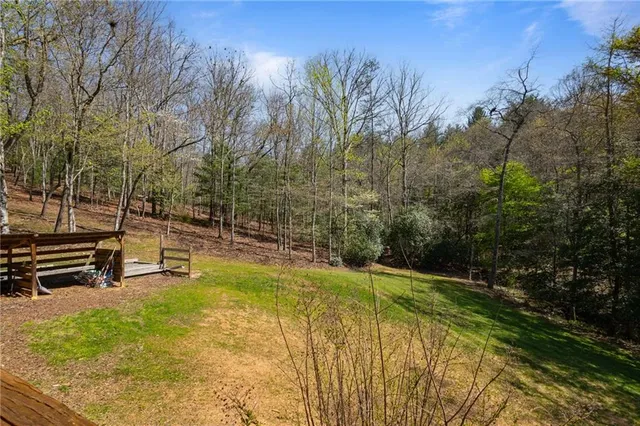 a view of a porch with wooden floor and iron stairs