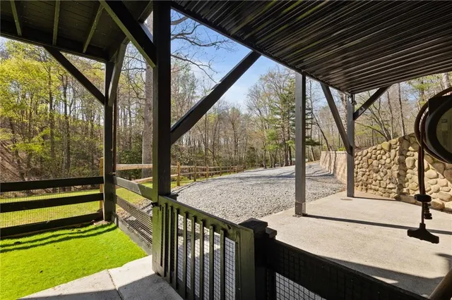 a view of road with large trees