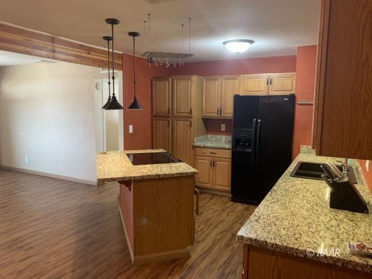 1004 South Farragut Street Ridgecrest, CA 93555 - Photo 4 of 13 a kitchen with stainless steel appliances granite countertop a refrigerator and a sink
