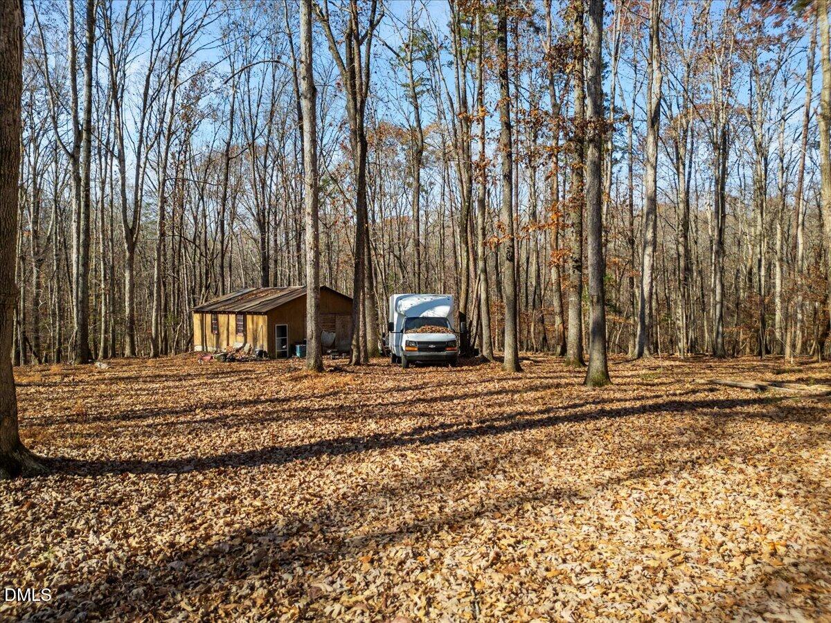407 Mountain Brook Road Rougemont, NC 27572 - Photo 20 of 23 a view of a house with a yard