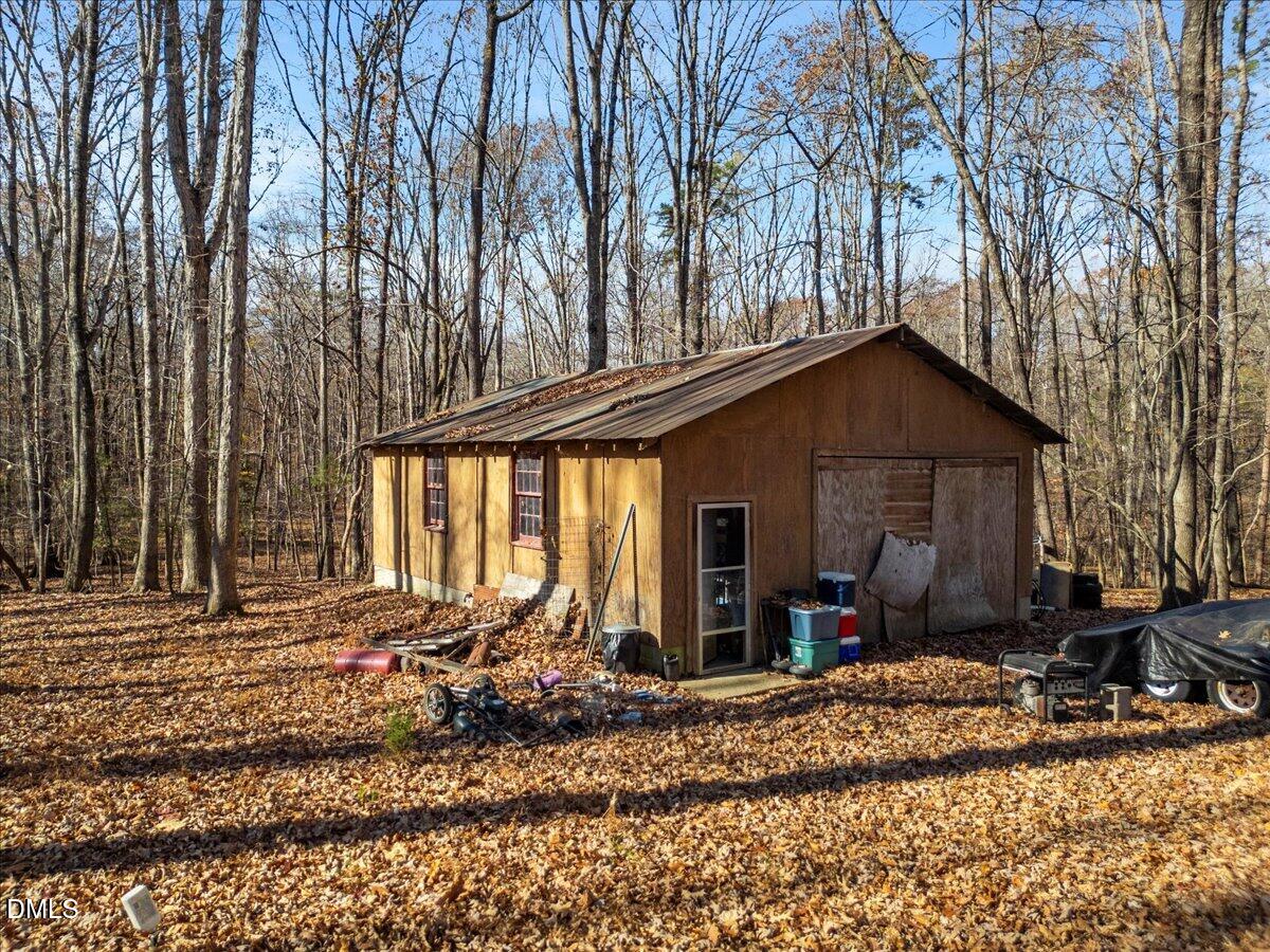407 Mountain Brook Road Rougemont, NC 27572 - Photo 22 of 23 a view of a house with backyard