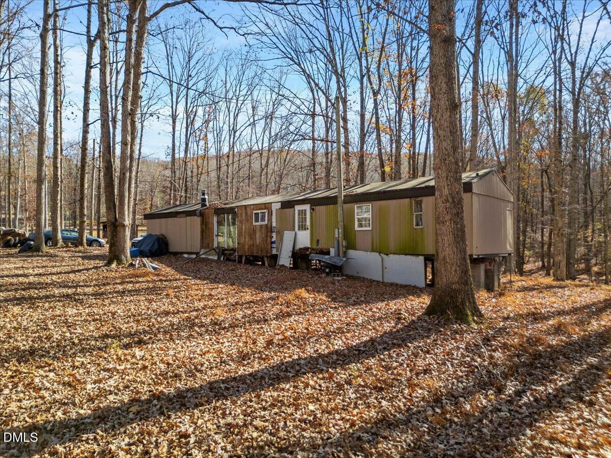 407 Mountain Brook Road Rougemont, NC 27572 - Photo 23 of 23 a view of a house with a yard covered in snow