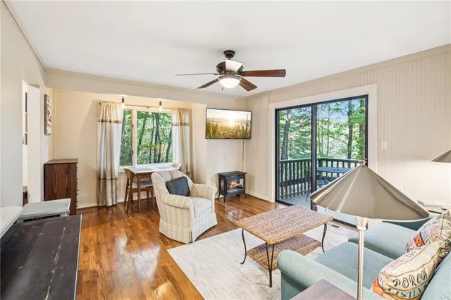 a living room with furniture a table and chairs