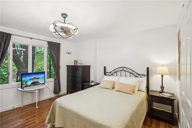 a bedroom with a bed and a table in it