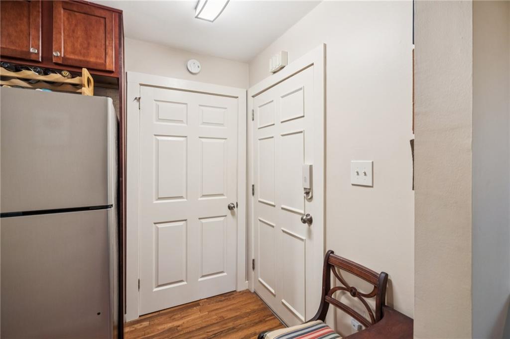 116 Sconti Ridge, Unit 419B Jasper, GA 30143 - Photo 5 of 17 a view of a storage and utility room with wooden floor