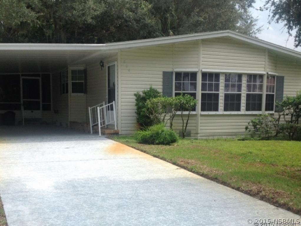 826 Navigators Way Edgewater, FL 32141 - Photo 1 of 1 a front view of a house with garden