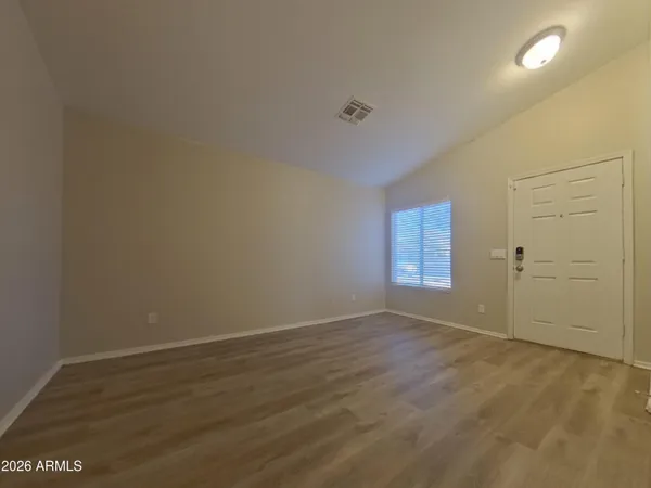 a view of an empty room and window