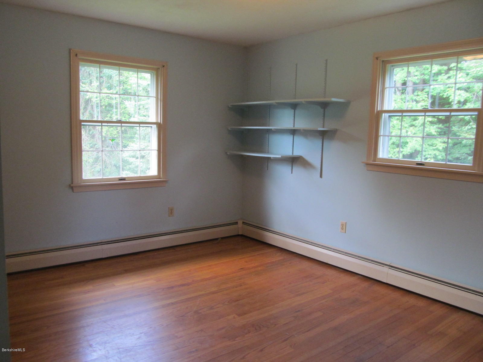898 Shaw Road Windsor, MA 01270 - Photo 14 of 34 an empty room with wooden floor and windows