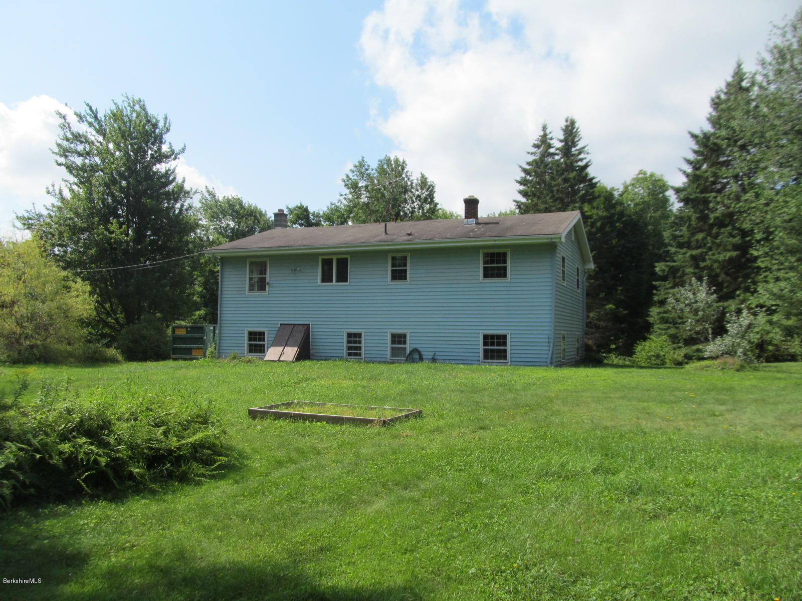 898 Shaw Road Windsor, MA 01270 - Photo 3 of 34 a front view of house with yard and trees