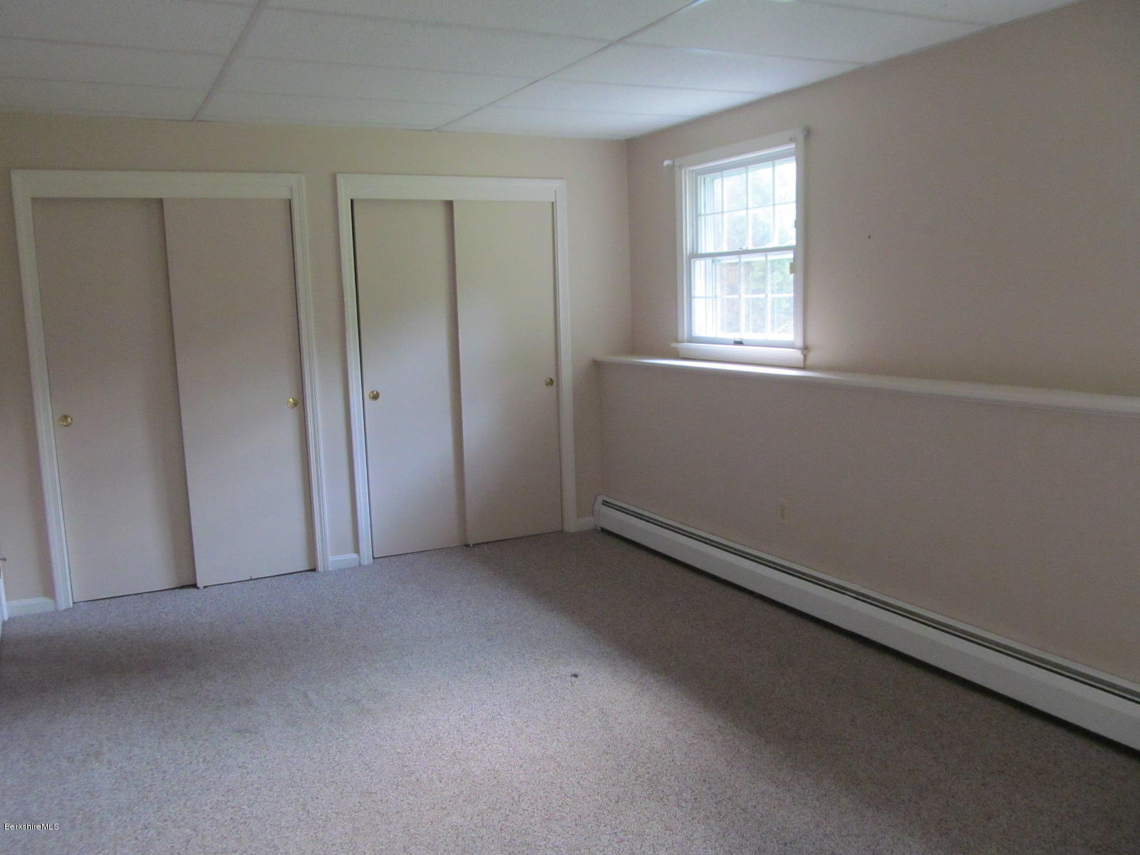 898 Shaw Road Windsor, MA 01270 - Photo 22 of 34 a view of an empty room with a window