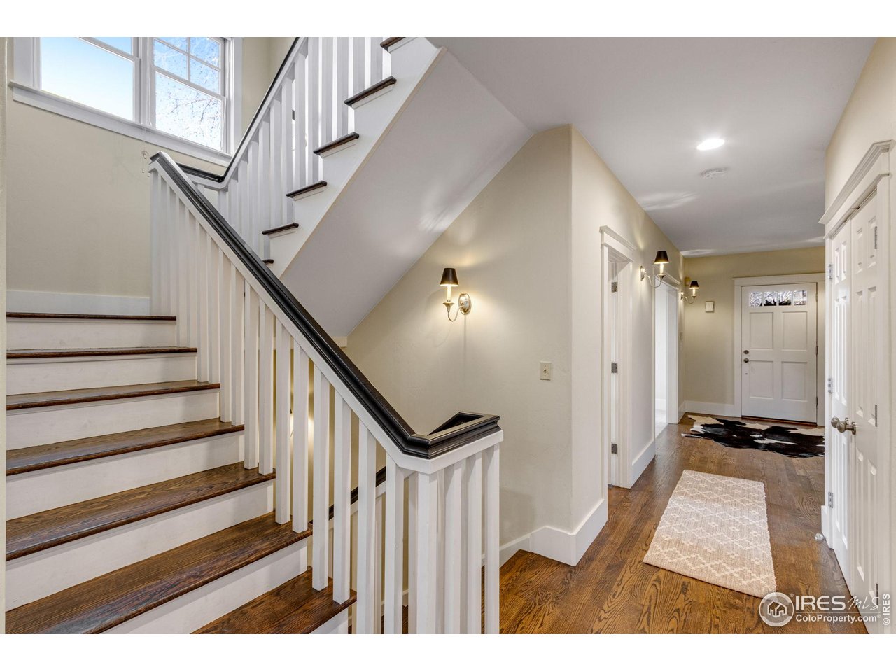 707 South Fillmore Street Denver, CO 80209 - Photo 13 of 47 a view of entryway with wooden floor