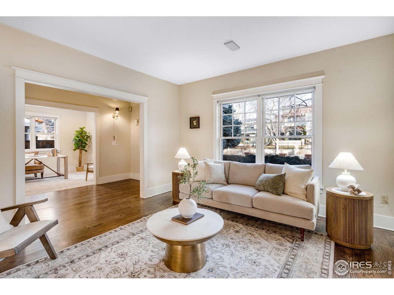 707 South Fillmore Street Denver, CO 80209 - Photo 14 of 47 a living room with furniture and a large window
