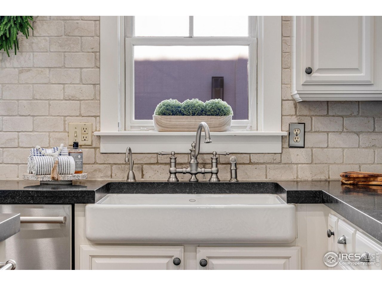 707 South Fillmore Street Denver, CO 80209 - Photo 22 of 47 a bathroom with a sink and a mirror