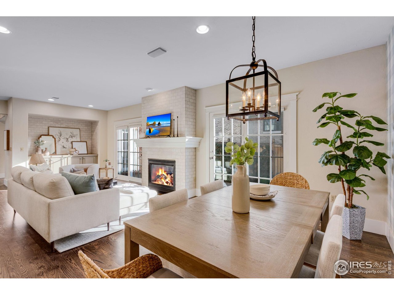 707 South Fillmore Street Denver, CO 80209 - Photo 25 of 47 a living room with furniture a fireplace and potted plants
