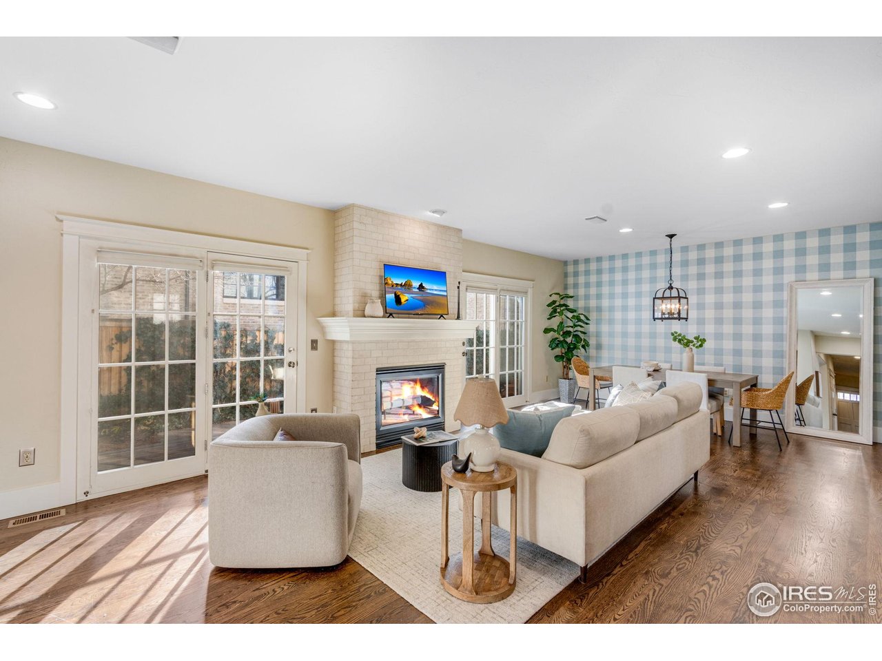 707 South Fillmore Street Denver, CO 80209 - Photo 28 of 47 a living room with fireplace furniture and a large window