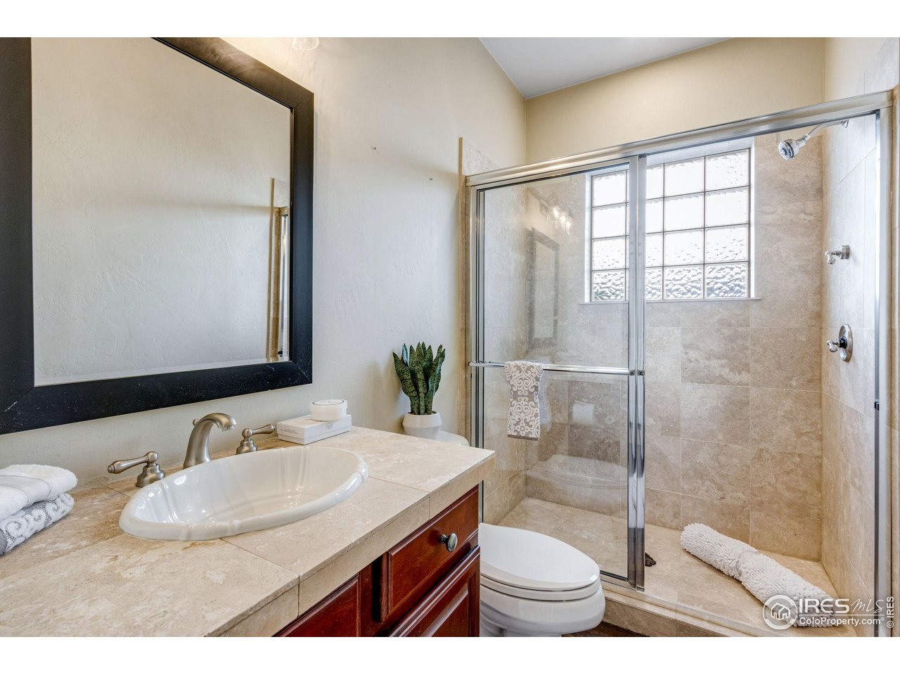 707 South Fillmore Street Denver, CO 80209 - Photo 37 of 47 a bathroom with a sink and a mirror