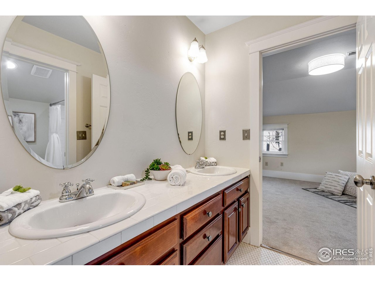 707 South Fillmore Street Denver, CO 80209 - Photo 38 of 47 a bathroom with a sink double vanity and a mirror