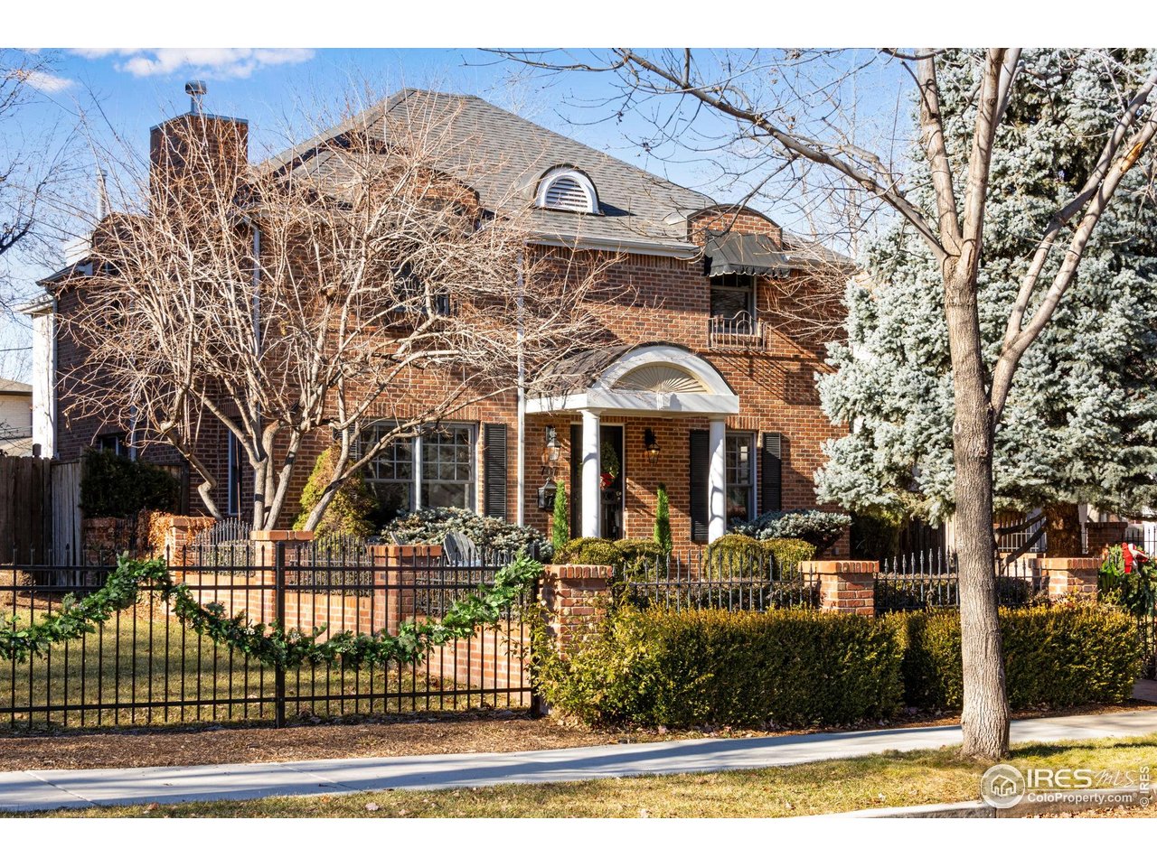 707 South Fillmore Street Denver, CO 80209 - Photo 4 of 47 a front view of a house with a garden