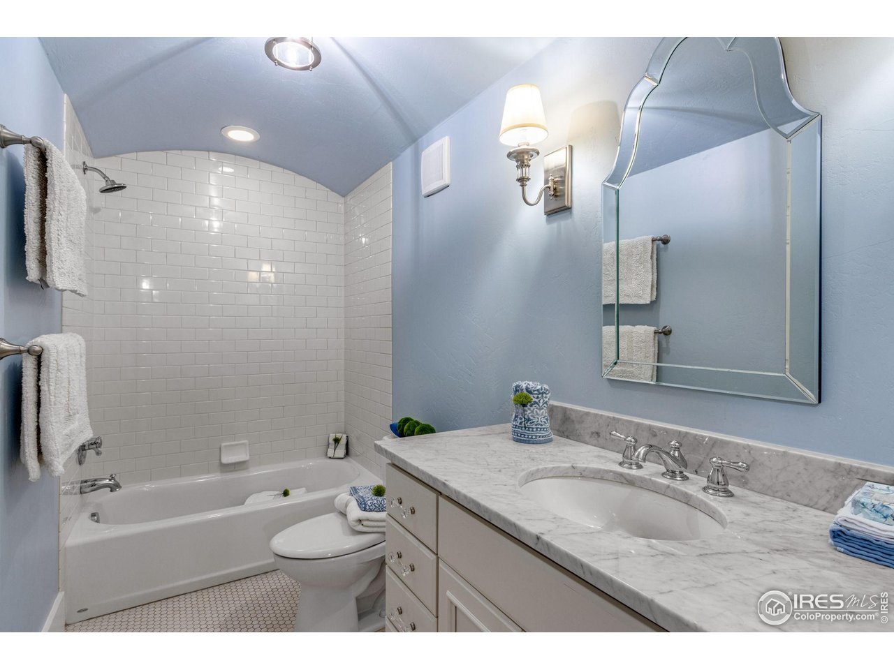 707 South Fillmore Street Denver, CO 80209 - Photo 44 of 47 a bathroom with a granite countertop sink and a mirror