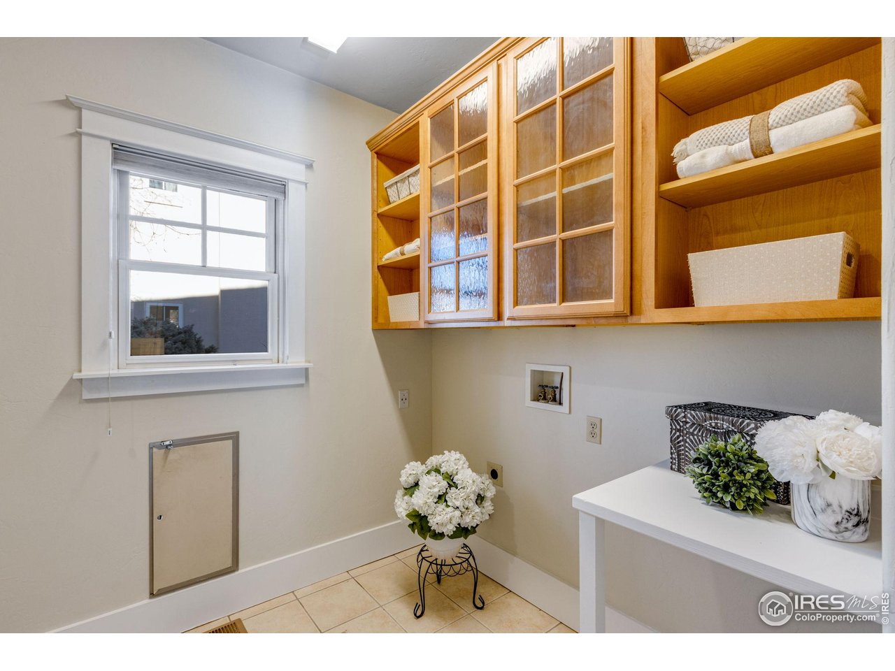 707 South Fillmore Street Denver, CO 80209 - Photo 45 of 47 a bathroom with a sink mirror and a window