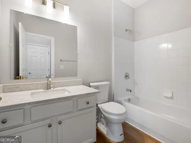 a bathroom with a sink a toilet and a bathtub