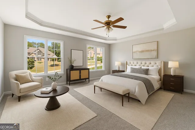 a bedroom with furniture and a large window