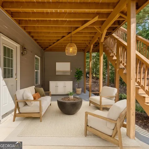 a outdoor living space with patio furniture and a potted plant