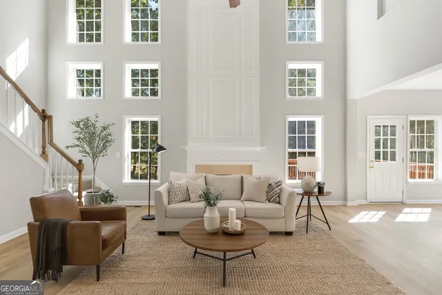 a living room with furniture and windows