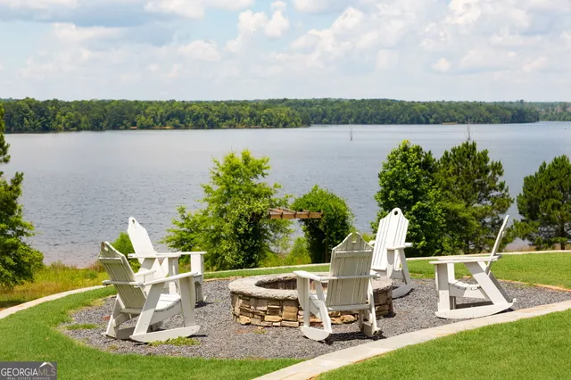 a view of a bench in backyard of the house