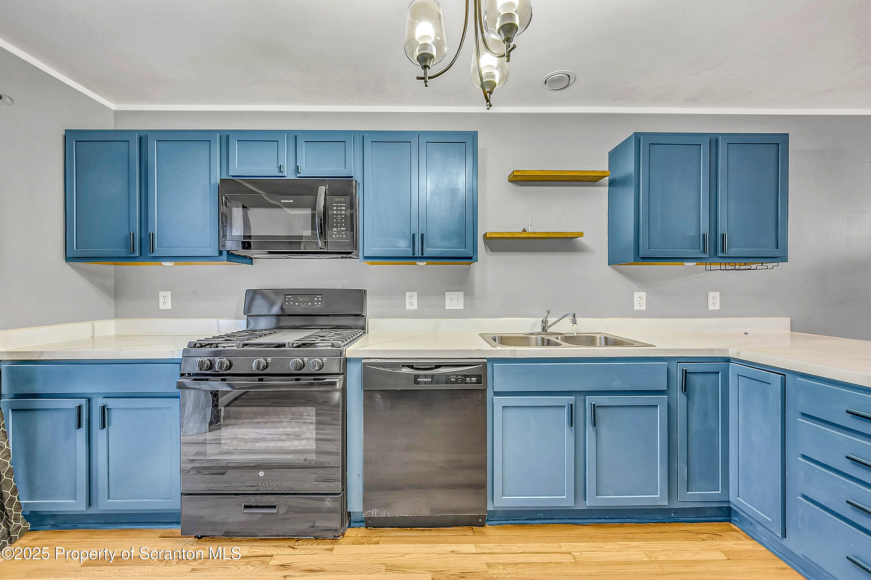 14 Fiore Court Duryea, PA 18642 - Photo 11 of 41 a kitchen with a sink and wooden cabinets