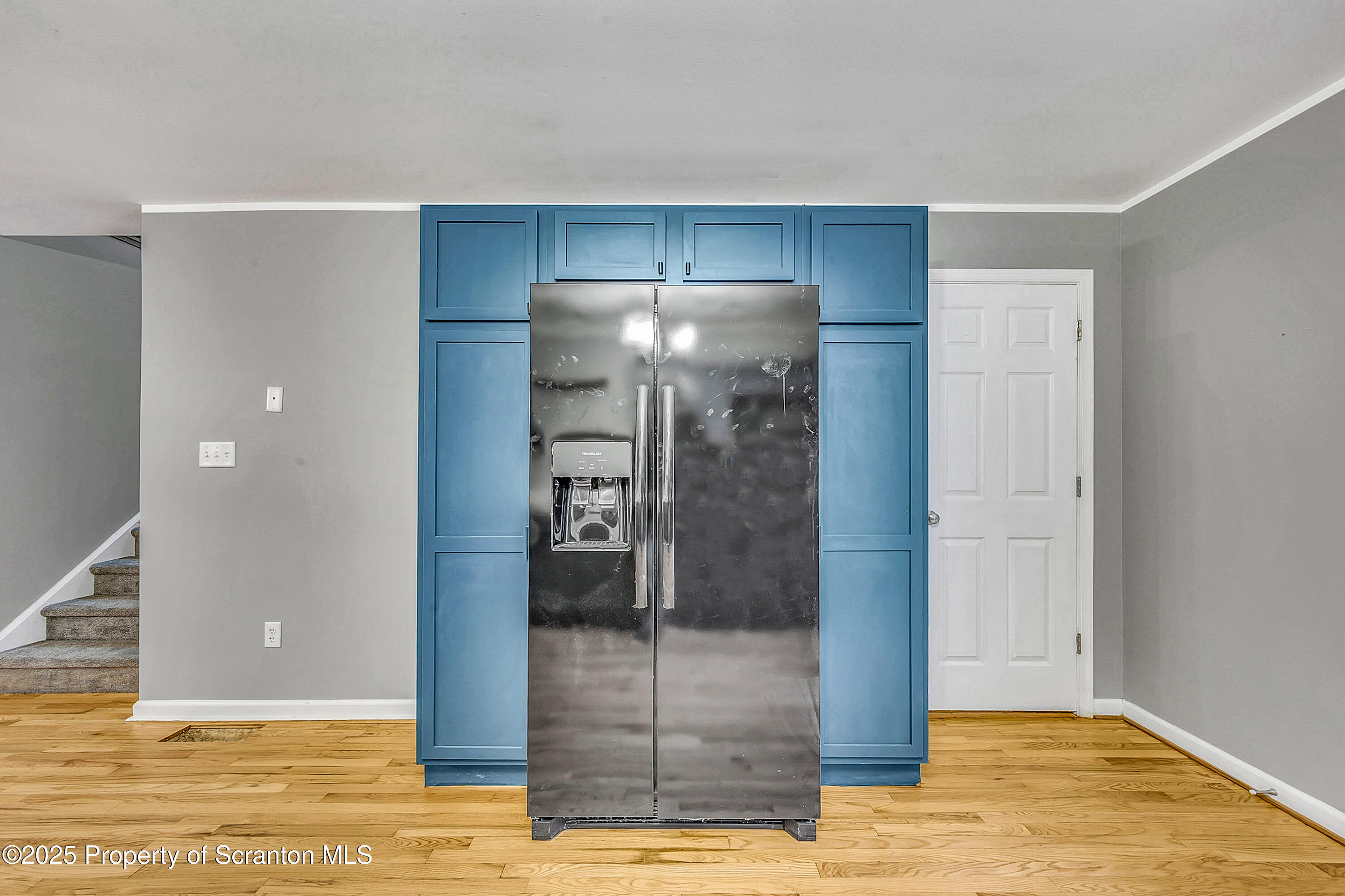 14 Fiore Court Duryea, PA 18642 - Photo 13 of 41 a view of a livingroom with wooden floor and kitchen space