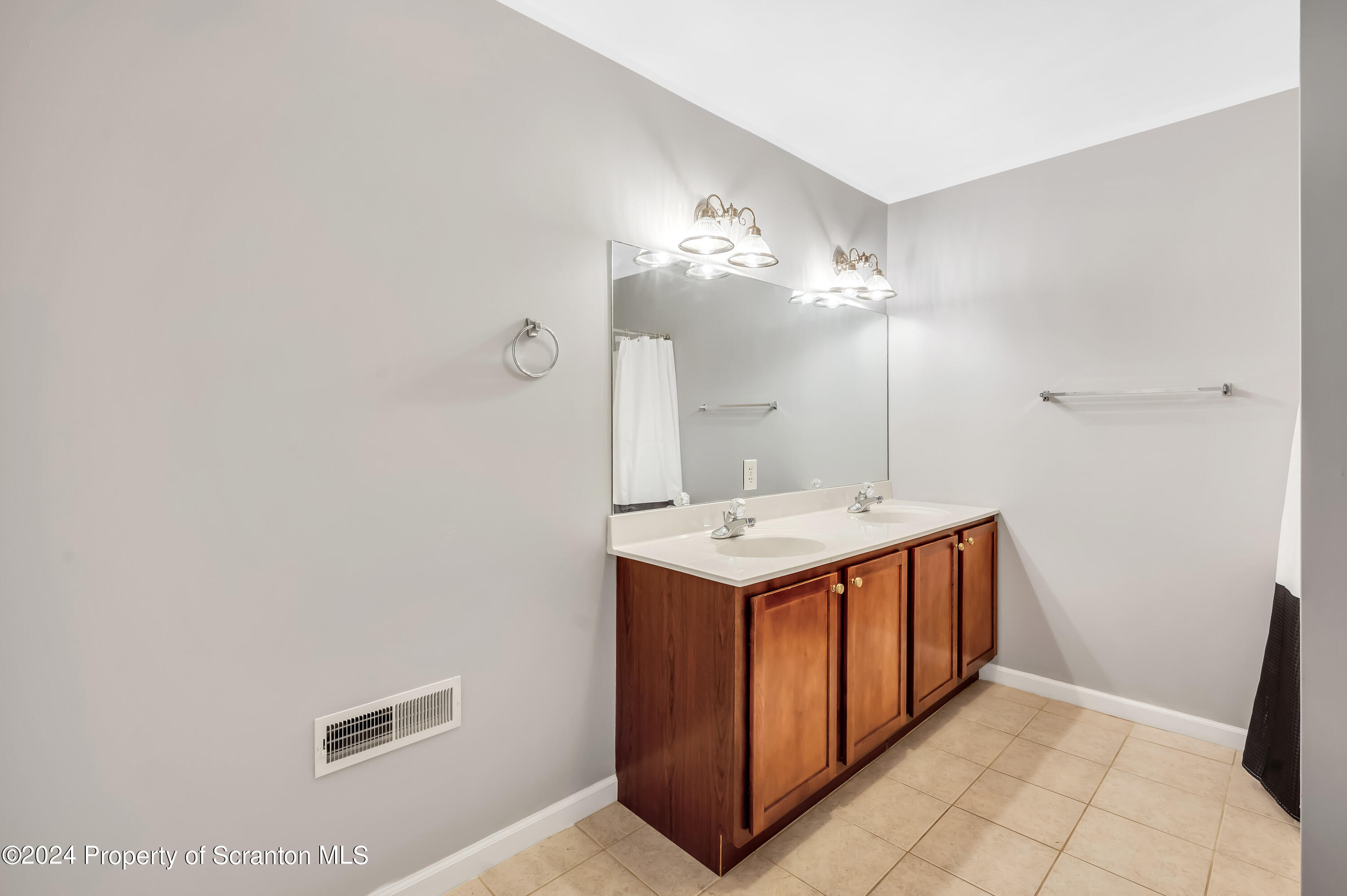 14 Fiore Court Duryea, PA 18642 - Photo 32 of 41 a utility room with a sink a mirror and vanity