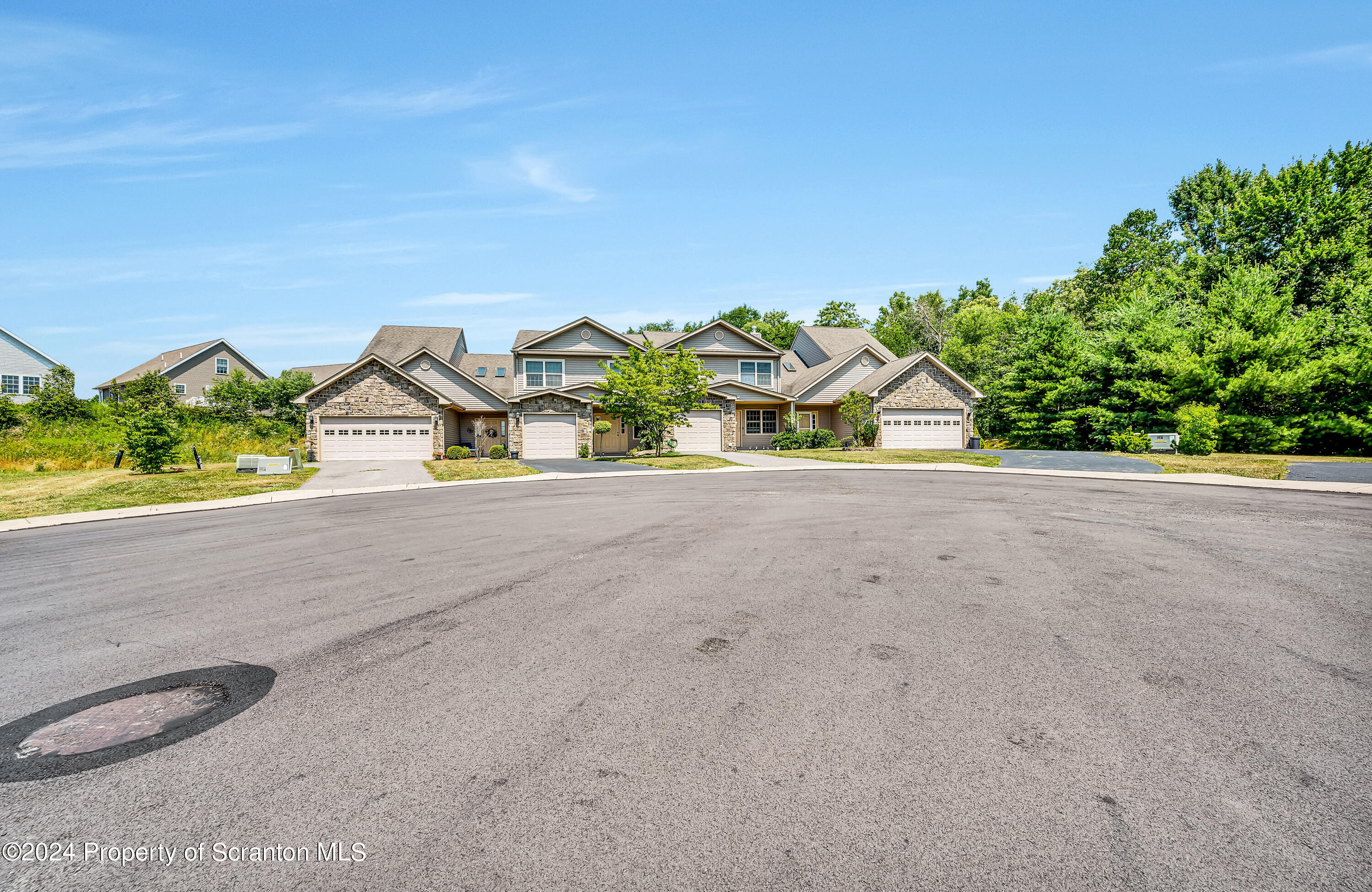 14 Fiore Court Duryea, PA 18642 - Photo 4 of 41 a view of a road with a cars park side of the road
