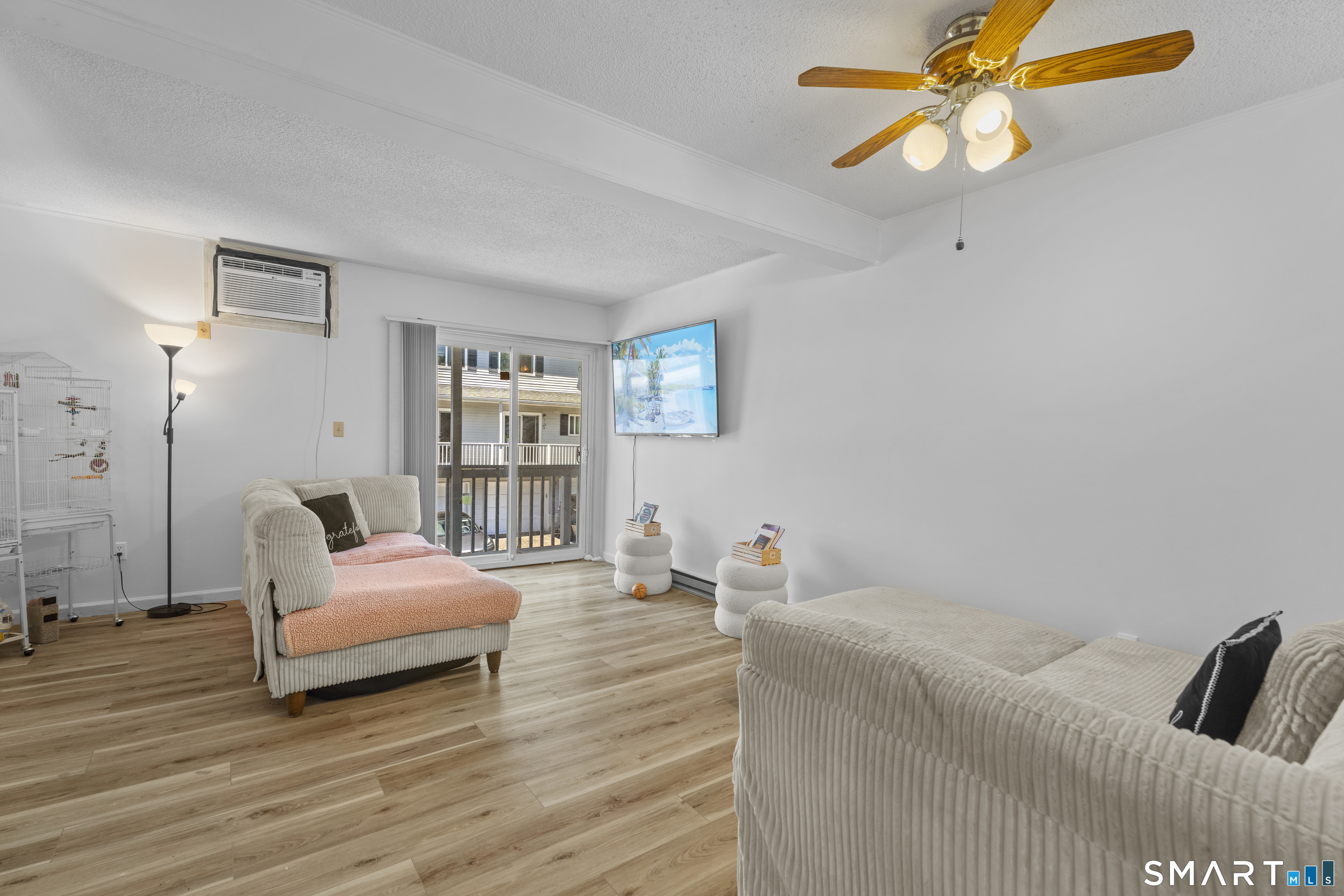 23 Pearl Lake Road, Unit B Waterbury, CT 06706 - Photo 4 of 14 a bedroom with a bed and wooden floor