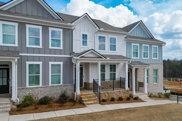 a front view of a house with a yard
