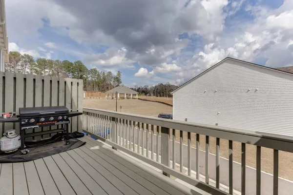 a view of a balcony with wooden floor