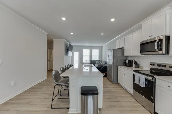 a kitchen with counter space cabinets and appliances