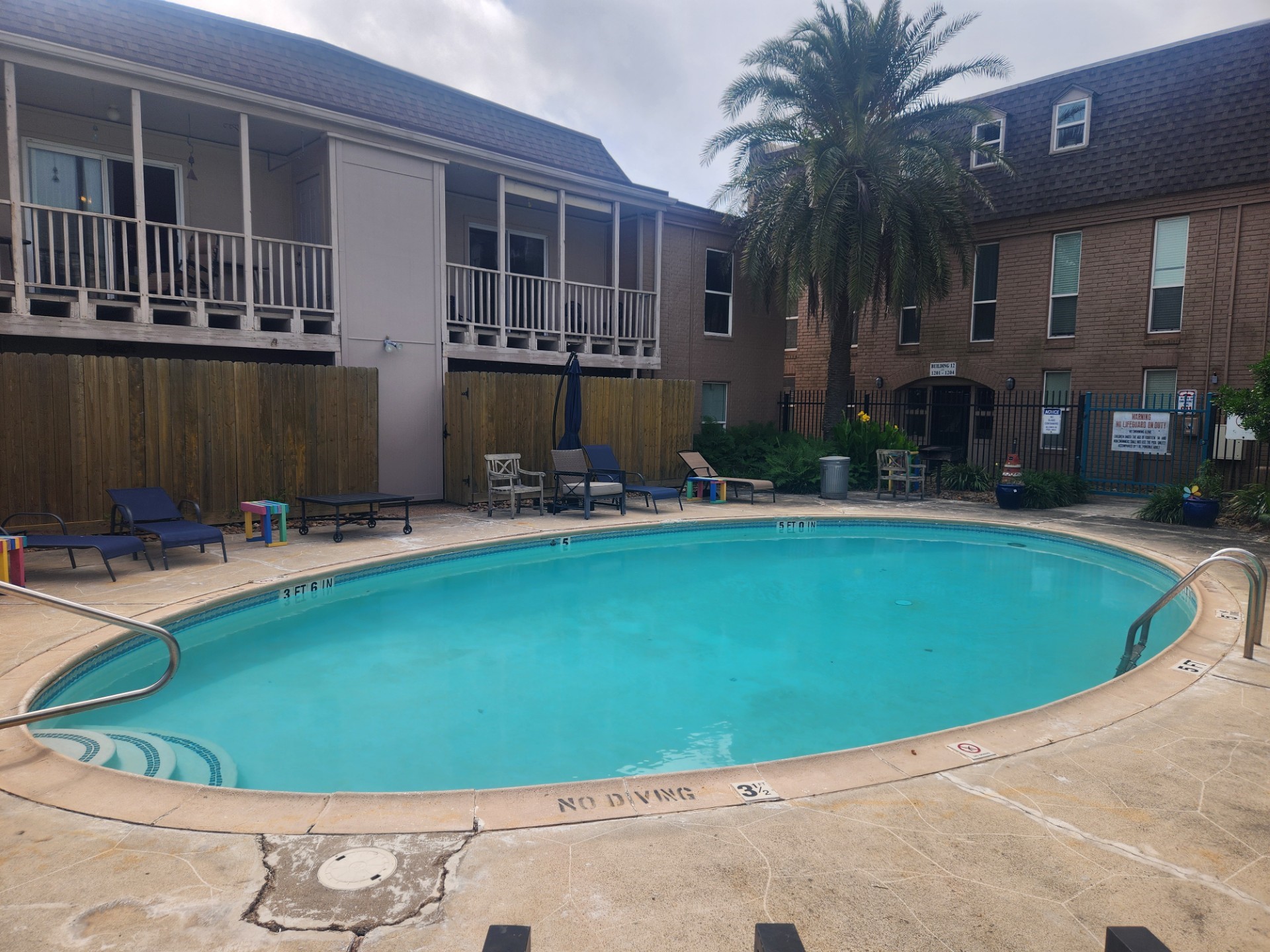 215 Postoffice Street, Unit 1005 Galveston, TX 77550 - Photo 1 of 16 a view of a house with swimming pool