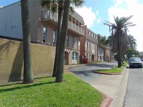 215 Postoffice Street, Unit 1005 Galveston, TX 77550 - Photo 13 of 16 a view of a water fountain in front of a house