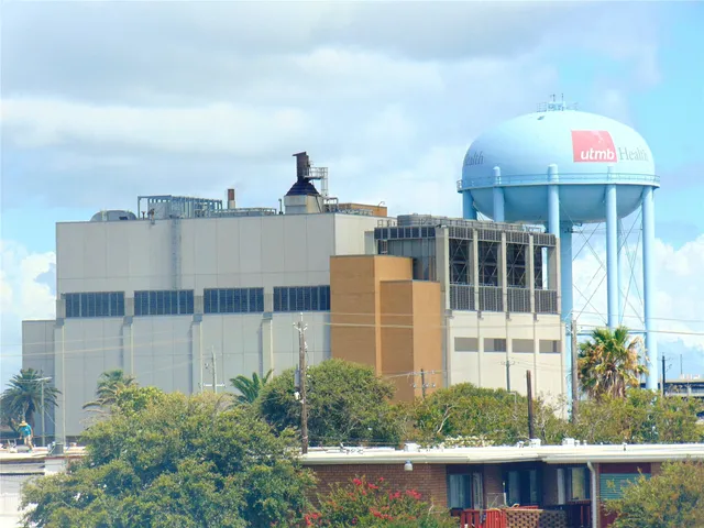 a front view of a house with a yard and sitting space