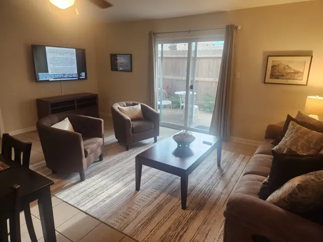 a living room with furniture and a window