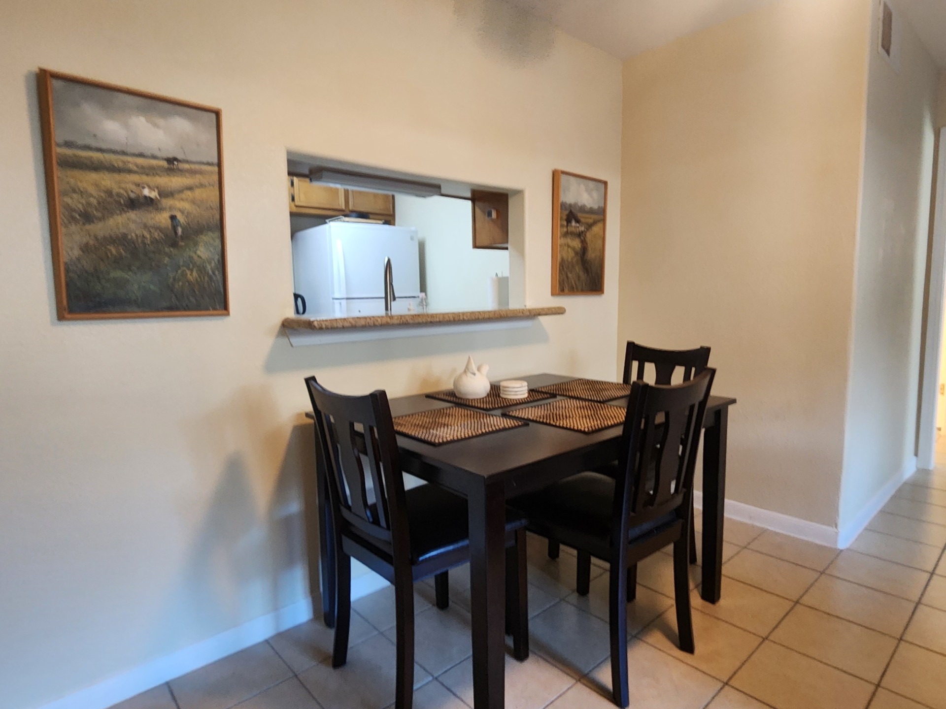 215 Postoffice Street, Unit 1005 Galveston, TX 77550 - Photo 4 of 16 a view of a dining room with furniture